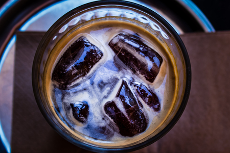 high contrast closeup shoot from a coffee glass. brown color is dominant at this one.の写真素材
