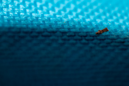 a macro shoot of swollen dirty blue cloth texture. bottom side got shadow.の写真素材