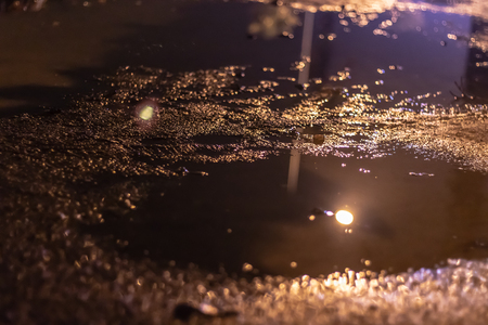 there is a pond at road with warm lightning. photo has taken at izmir turkey.の写真素材