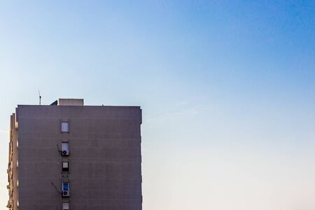 a distant architectural shoot from a building with clear sky as background. photo has taken at...