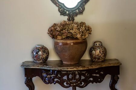 yellow color dominated good composed shoot from some antique items. there is some vases, containers...
