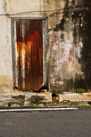Stained plaster walls with colorful doors zincの写真素材