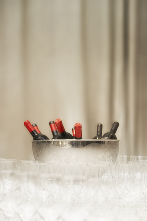 Cool wine bottles waiting to be servedの写真素材