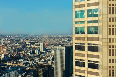 A view of the Japanese capital city and close skyscrapers as seen from the Metropolitan Government Building in downtown Tokyoのeditorial素材