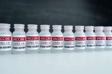 plastic medical bottles with label, Vaccine COVID-19の写真素材