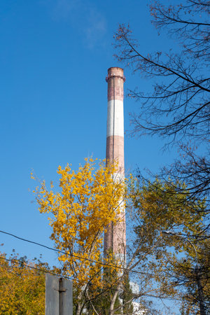 CHPP pipe in autumn against the blue sky. Russiaの写真素材