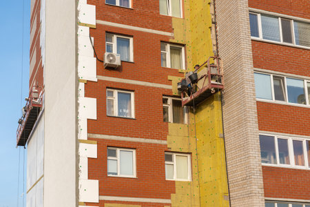 Building the cradle with the workers, repair of a facade of Russiaの写真素材