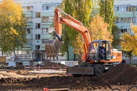 Agidel, RUSSIA - September 25, 2020 backhoe works in the Park. The improvement of the urban environment in Russiaのeditorial素材