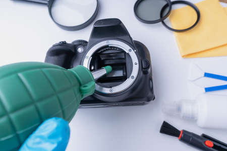 Cleaning soap from the camera matrix using an air blowerの写真素材