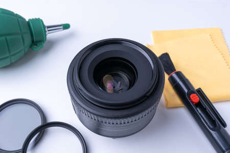 Cleaning the lens dust cleaning brush