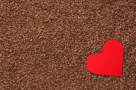 Red heart on the background of buckwheatの写真素材