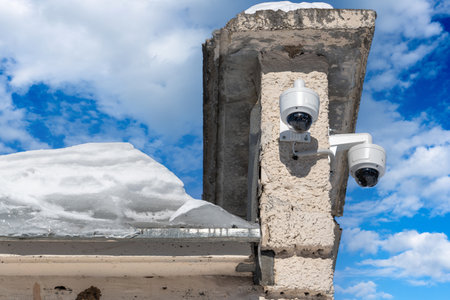 Outdoor video surveillance camera on the facade of the building. Russia, winter timeの写真素材