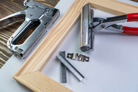 Devices for stretching canvas on a wooden frame.の写真素材