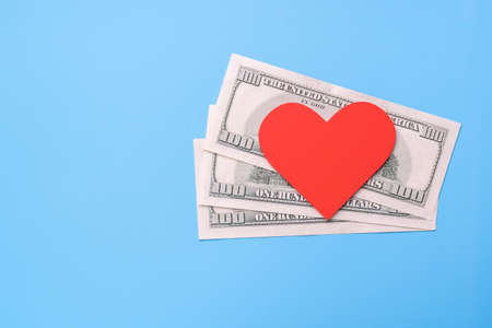Red heart lies on American dollarsの写真素材