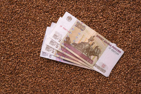 Russian money lies on buckwheat, top viewの写真素材