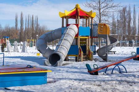 Playground for children in a winter park, Russia.の写真素材