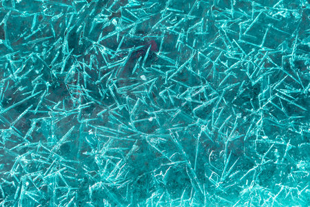 Emerald ice texture, frozen water in winterの写真素材