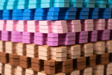 Multi-colored children's rugs in a stack. Foam floor covering in the form of puzzles for children to play on the floorの写真素材