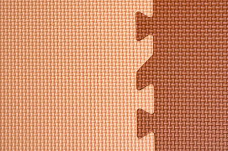 eva foam floor tiles, brown and beige in kindergarten or gym. Puzzle connecting lockの写真素材