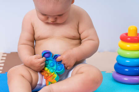 Toddler child playing with modern toy  . Close upの写真素材