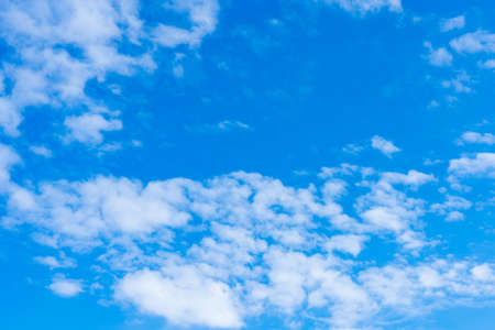 Blue sky with beautiful clouds. White cumulus cloudsの写真素材
