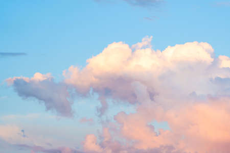 Beautiful yellow-white clouds illuminated by the setting sun.