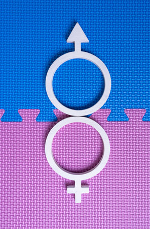 White symbols of man and woman form the sign of supernaturals, superstraight. Vertical fotoの写真素材