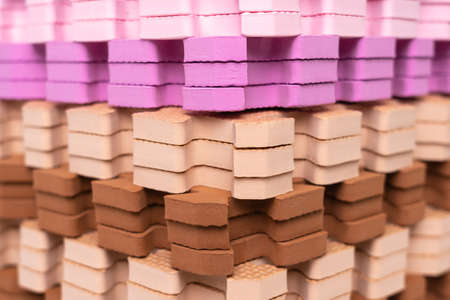 Multi-colored children's rugs in a stack.の写真素材