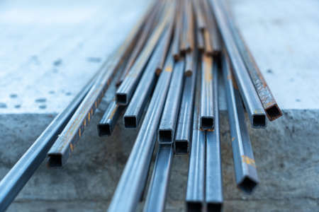 Metal profile and rusty reinforcement for foundation at construction site, selective focusの写真素材