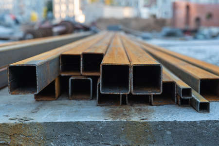Rusty square shaped metal profile at construction site, selective focusの写真素材
