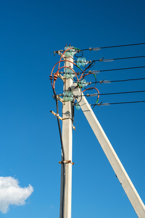 Concrete Power Line Pole, underground power cable goes into overhead lineの写真素材