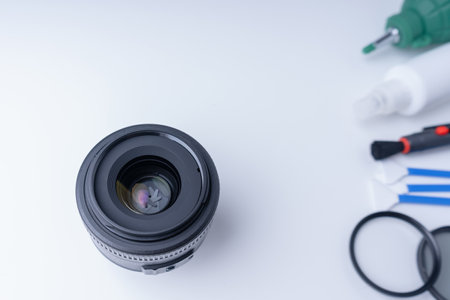 Camera lens and accessories for cleaning the camera on a white backgroundの写真素材