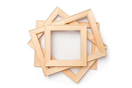 A stack of square and rectangular wooden stretchers for canvas stretching on a white background