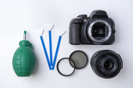 Tools for cleaning the sensor and lens of a DSLR cameraの写真素材