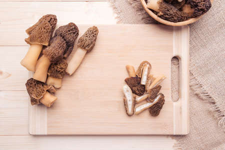 Morel mushrooms on a cutting board, top viewの写真素材