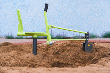 Excavator toy on the playgroundの写真素材