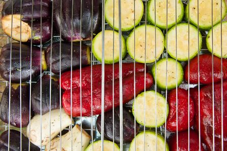 slices of red pepper, eggplant and zucchini on the grillの写真素材