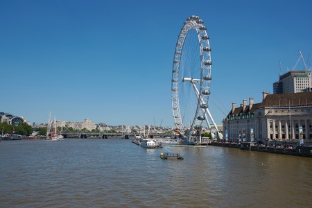 LONDON / ENGLAND - June 26, 2018 : View of the London Eye. London Eye (135 m tall, diameter of 120 m) - famous tourist attraction in London over river Thames.のeditorial素材