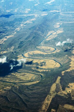 The winding channel of the river. Photo taken from an airplane window presumably above Washington...