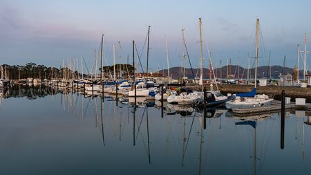 San Francisco, California / USA - Feb 7th 2019 - yachts in a marina in front of Golden Gate Bridge on February morningのeditorial素材