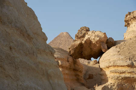 The Great Pyramid of Giza (also known as the Pyramid of Khufu or the Pyramid of Cheops) is the oldest and largest. view from surrounding hills.の写真素材