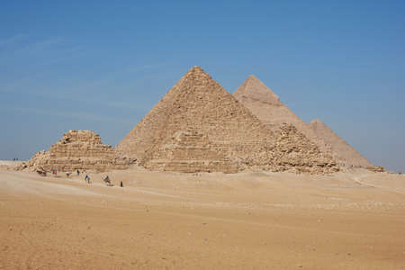 The Giza pyramid complex, also called the Giza Necropolis on the Giza Plateau in Egypt including the Great (Cheops) Pyramid of Giza, the Pyramid of Khafre, and the Pyramid of Menkaure  and pyramids of Queensのeditorial素材