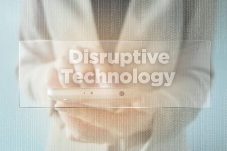Close-up Of young businesswoman using smartphone with Disruptive Technologyの写真素材