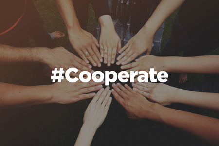 Collaboration Concept with text: Cooperateの写真素材