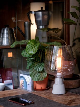 minimalist table lamp with coffee maker as background