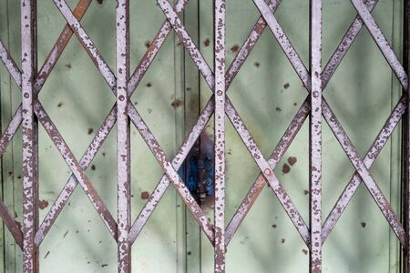 rusty and old design grill doorの写真素材