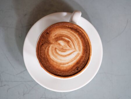 latte art coffee in a white cup