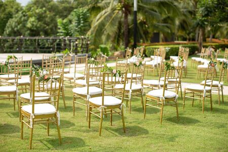 Beautiful and rustic garden wedding setup on a sunny day during summer.の写真素材