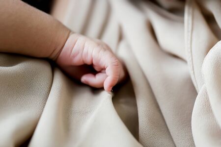a small cute baby handの写真素材
