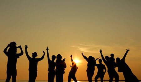 silhouette of a happy family during sunset.の写真素材